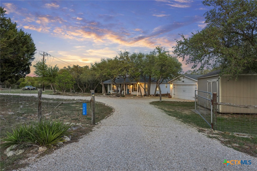 1328 Cottonwood Road Fischer, TX 78623 - Photo 31 of 35 a front view of a house with a yard