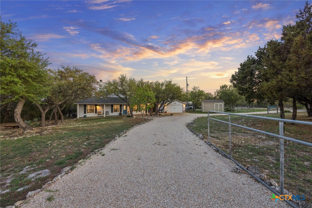1328 Cottonwood Road Fischer, TX 78623 - Photo 35 of 35 a view of a street with a yard