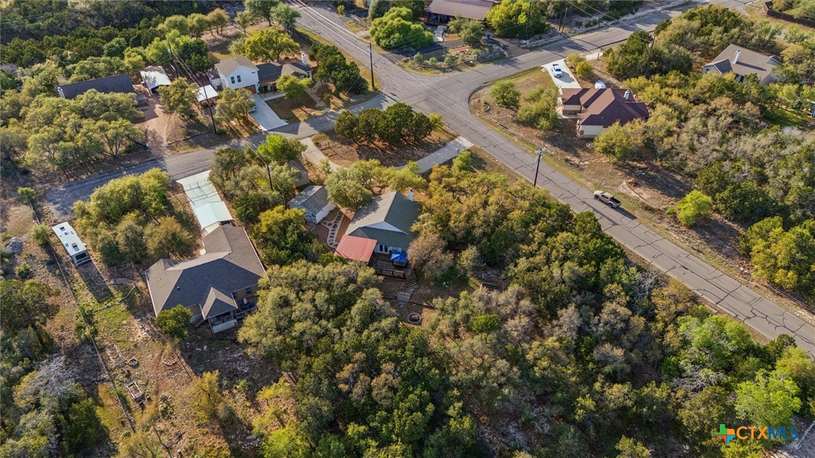 1328 Cottonwood Road Fischer, TX 78623 - Photo 7 of 35 an aerial view of a house with a yard and large trees