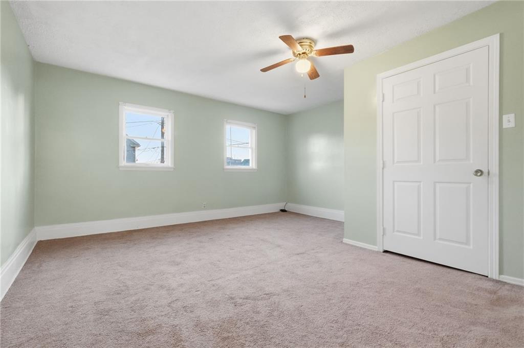 518 Cross Street Rochester, PA 15074 - Photo 16 of 24 an empty room with windows and fan