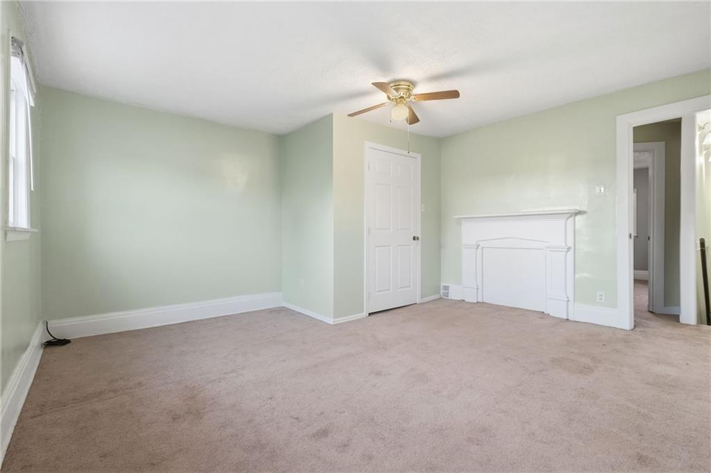 518 Cross Street Rochester, PA 15074 - Photo 17 of 24 an empty room with a chandelier fan and closet