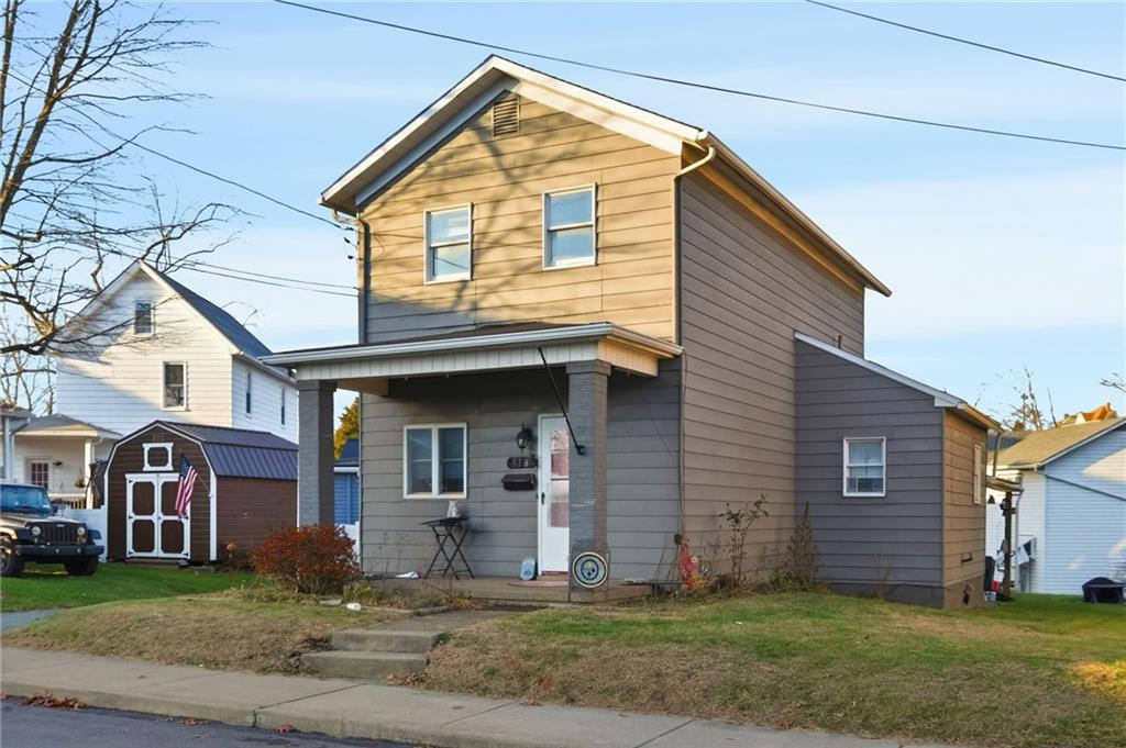 518 Cross Street Rochester, PA 15074 - Photo 2 of 24 a view of a brick house with many windows
