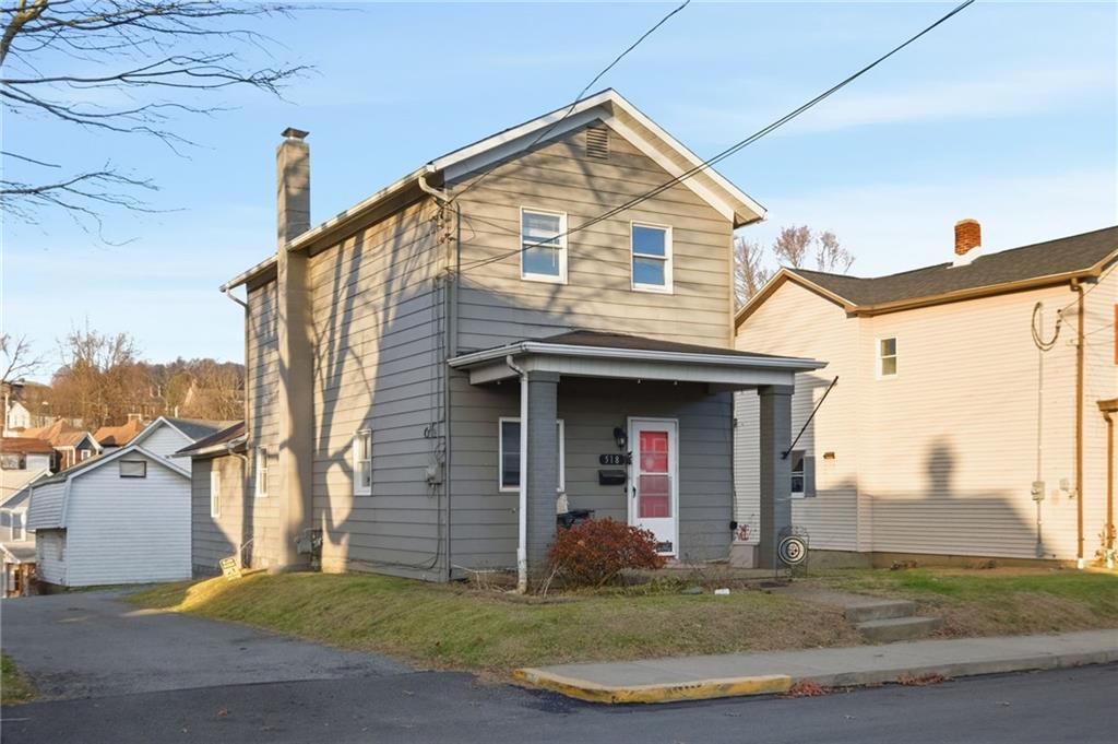 518 Cross Street Rochester, PA 15074 - Photo 3 of 24 a front view of a house with a yard