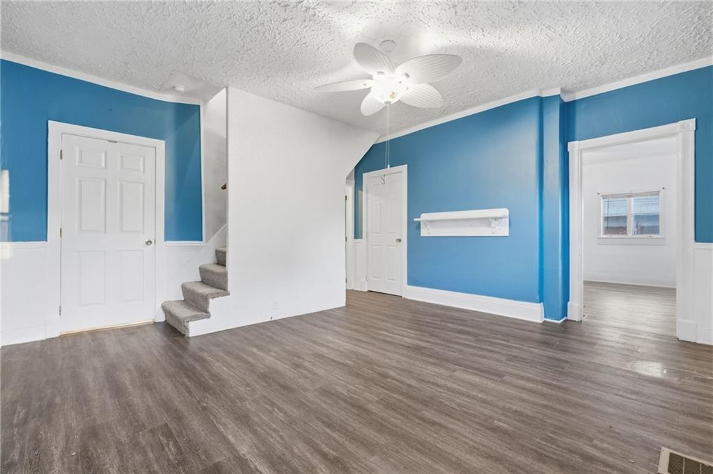 518 Cross Street Rochester, PA 15074 - Photo 7 of 24 a view of an empty room with wooden floor