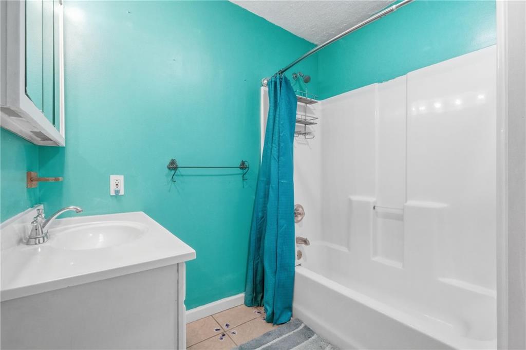 518 Cross Street Rochester, PA 15074 - Photo 9 of 24 a bathroom with a sink and a mirror