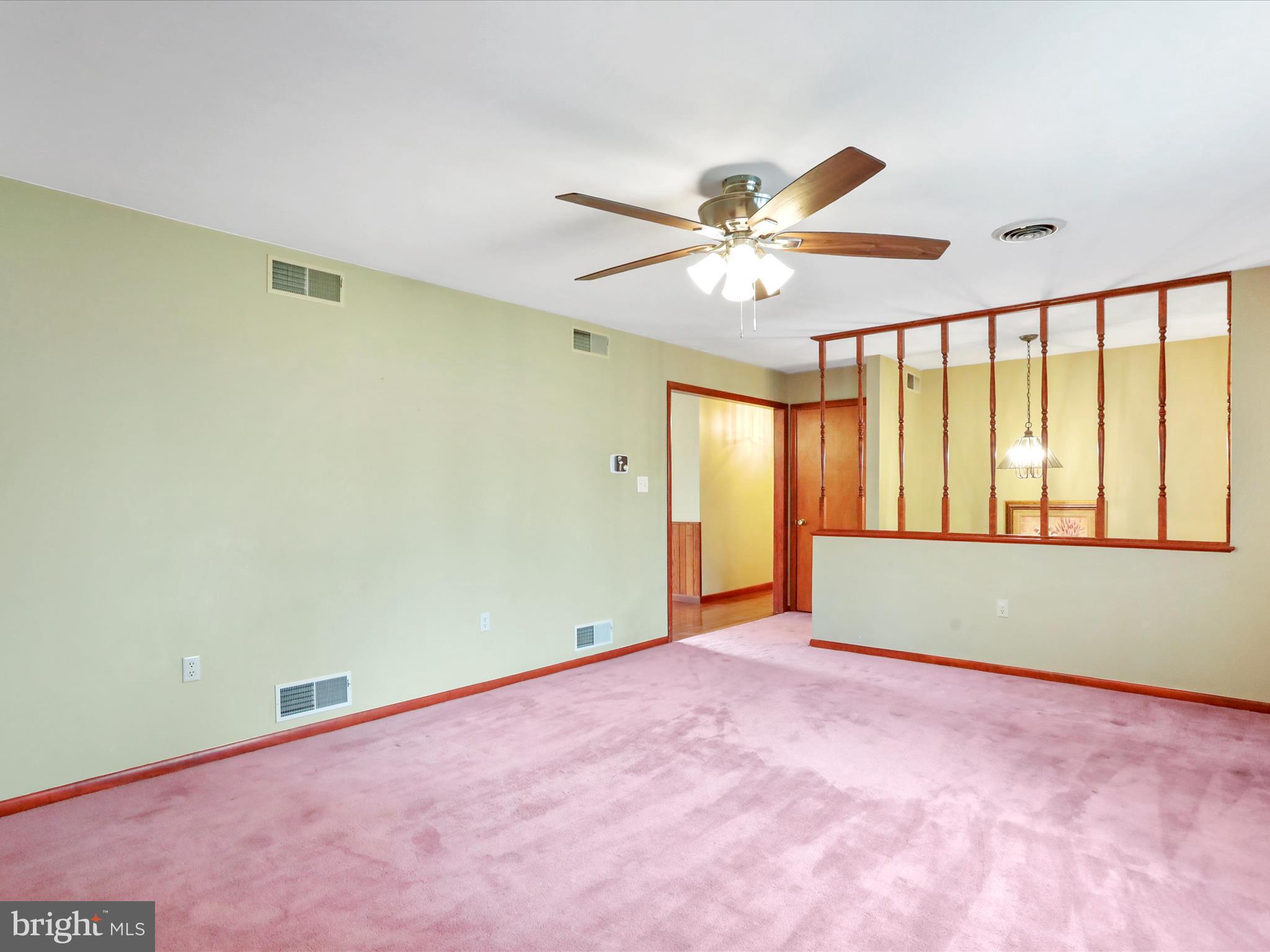 47 Diffys Drive Shippensburg, PA 17257 - Photo 12 of 48 an empty room with chandelier fan and windows
