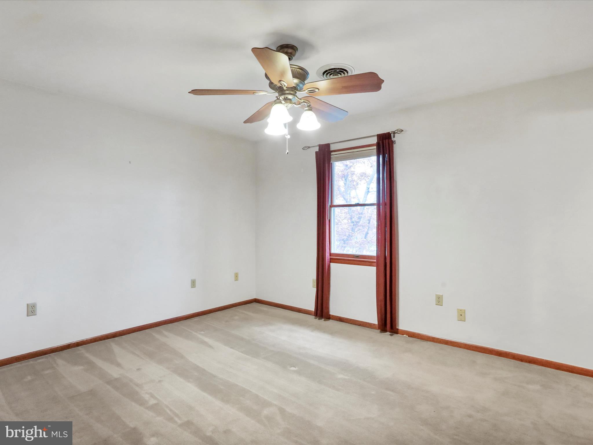 47 Diffys Drive Shippensburg, PA 17257 - Photo 19 of 48 an empty room with a window and a fan