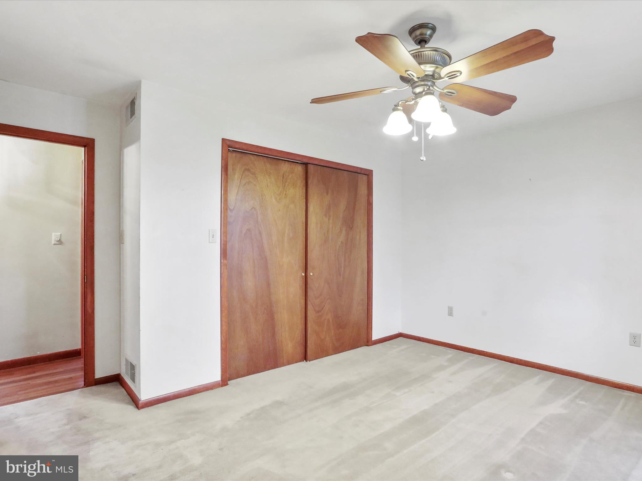 47 Diffys Drive Shippensburg, PA 17257 - Photo 21 of 48 an empty room with a chandelier fan and a window