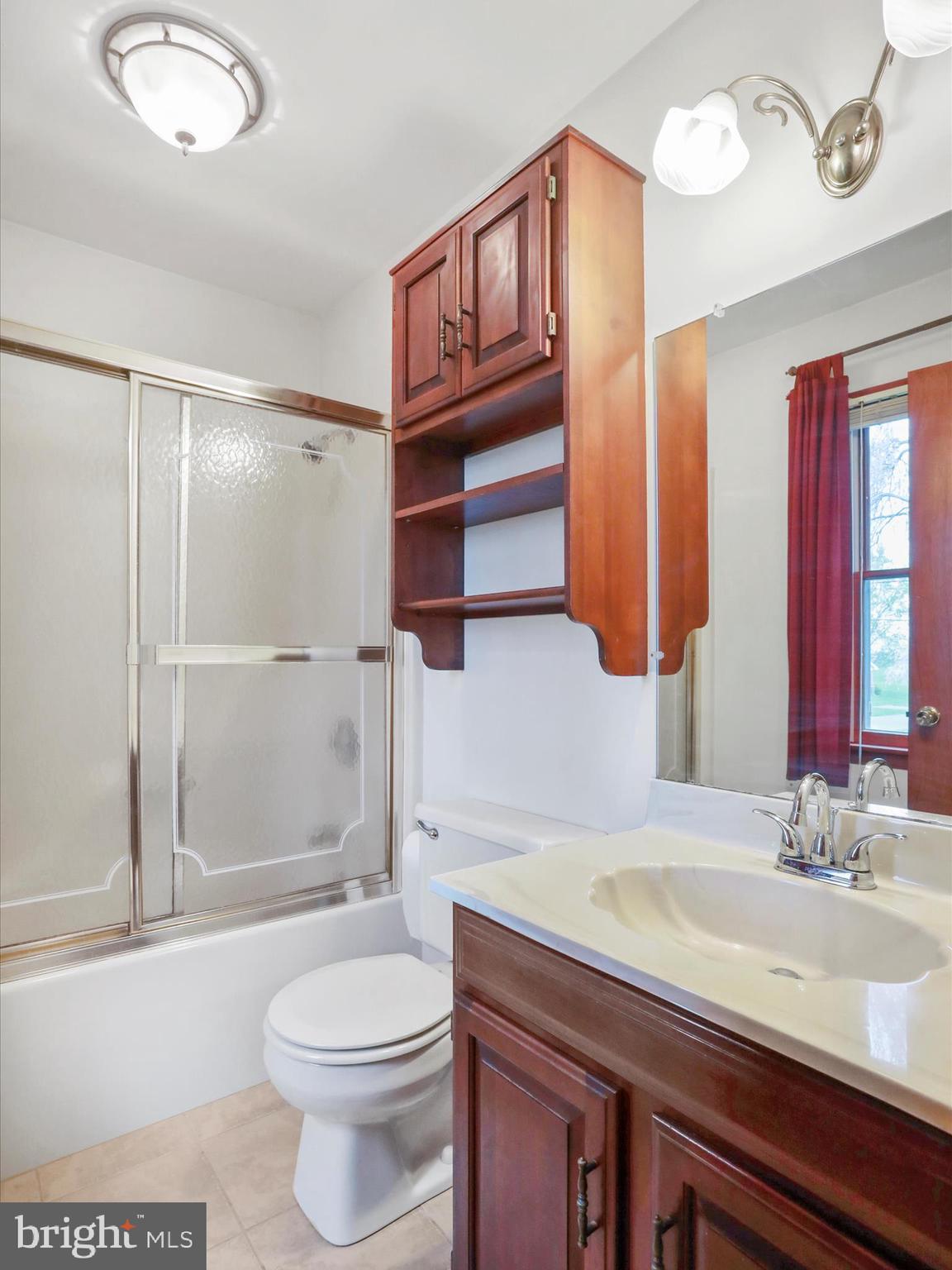 47 Diffys Drive Shippensburg, PA 17257 - Photo 22 of 48 a bathroom with a granite countertop toilet sink and shower