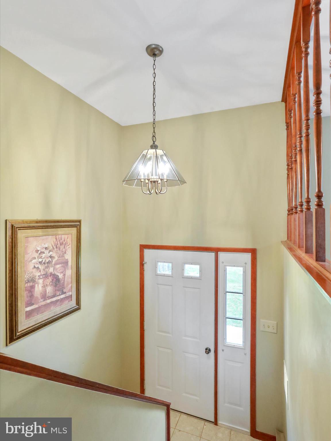 47 Diffys Drive Shippensburg, PA 17257 - Photo 23 of 48 a view of a hallway with a chandelier