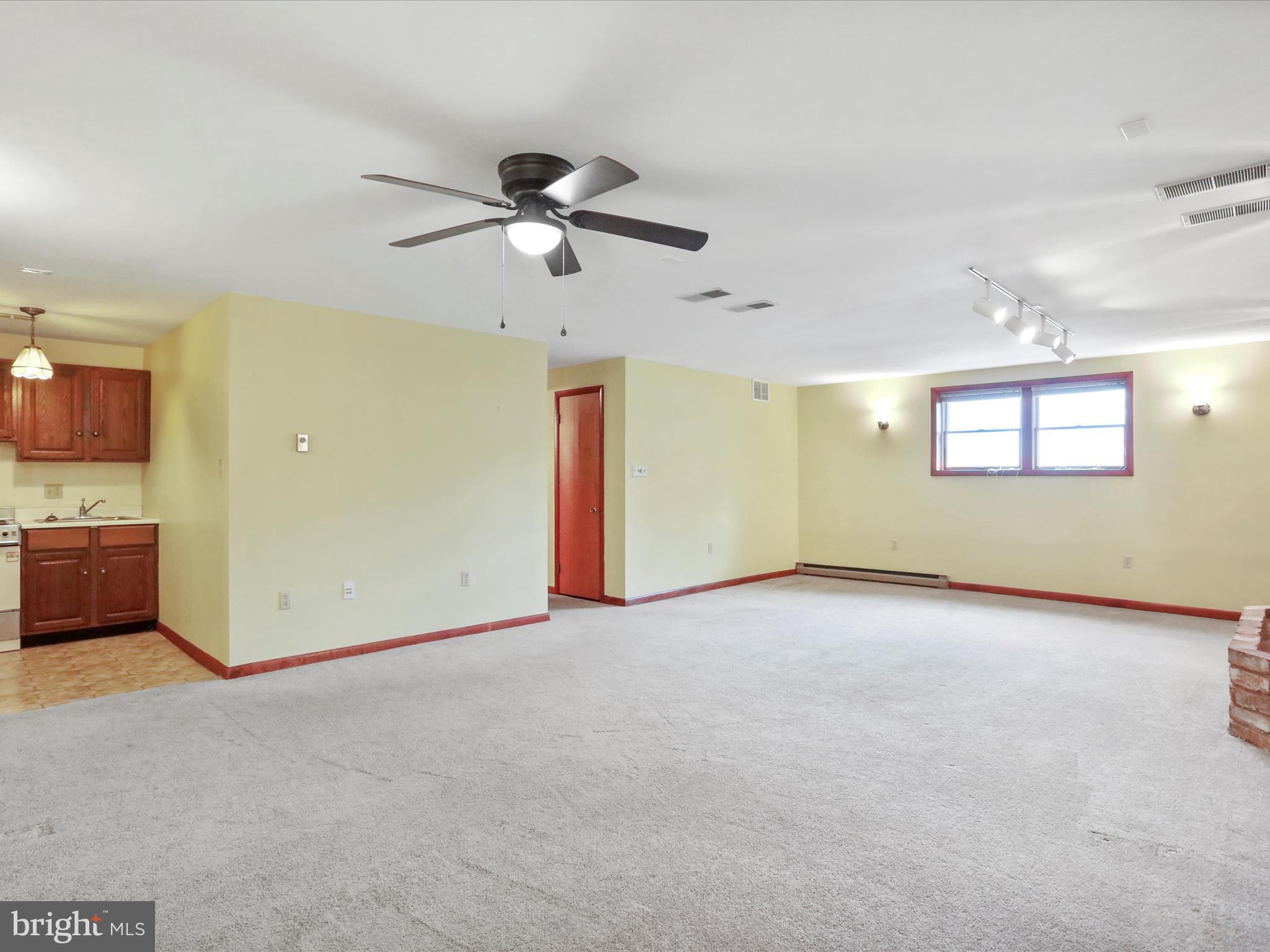 47 Diffys Drive Shippensburg, PA 17257 - Photo 26 of 48 a view of a livingroom with a ceiling fan and window