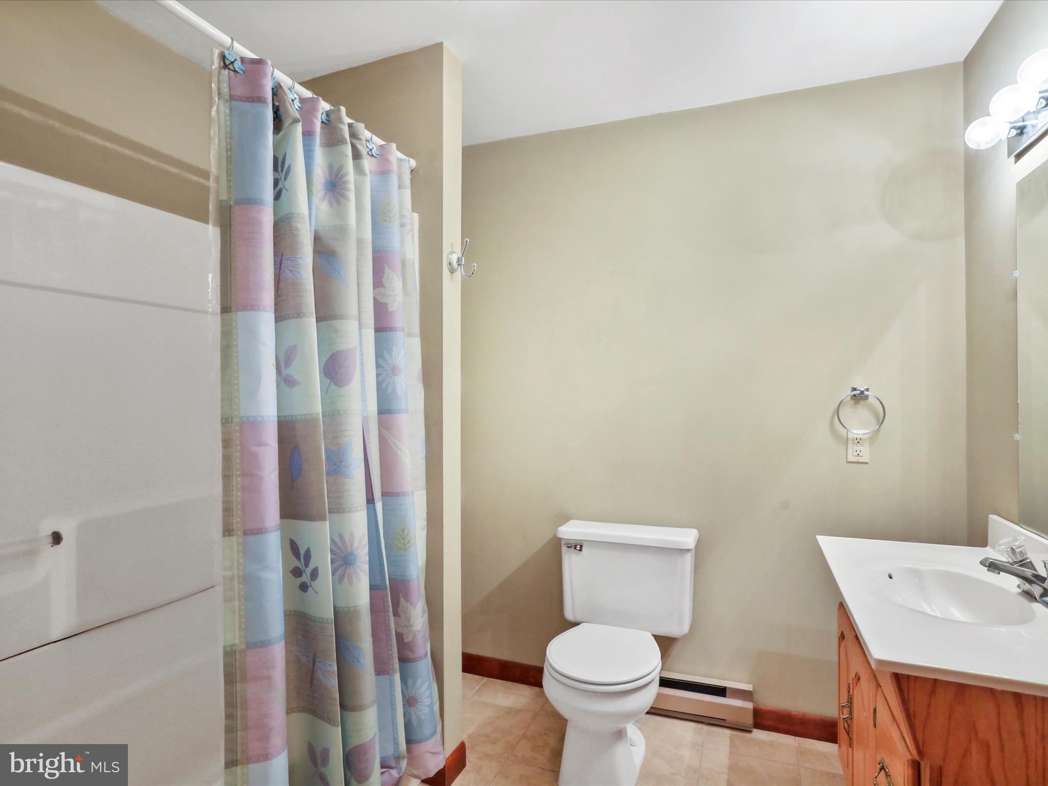 47 Diffys Drive Shippensburg, PA 17257 - Photo 27 of 48 a bathroom with a toilet a sink and shower