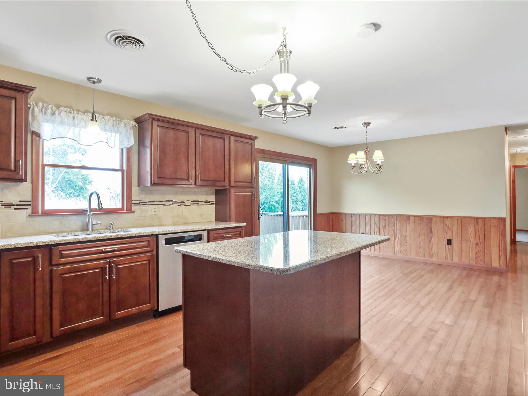 47 Diffys Drive Shippensburg, PA 17257 - Photo 5 of 48 a large kitchen with kitchen island a large island in the center a sink a window and stainless steel appliances