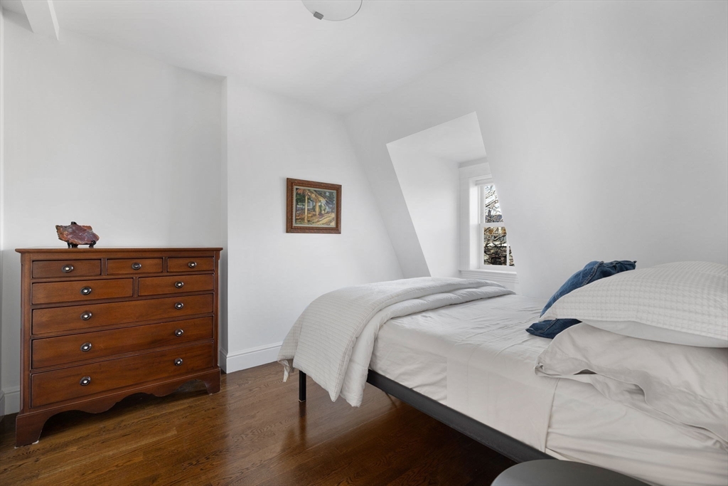 34 Dwight Street, Unit 2 Boston, MA 02118 - Photo 14 of 22 a bedroom with a bed and a dresser