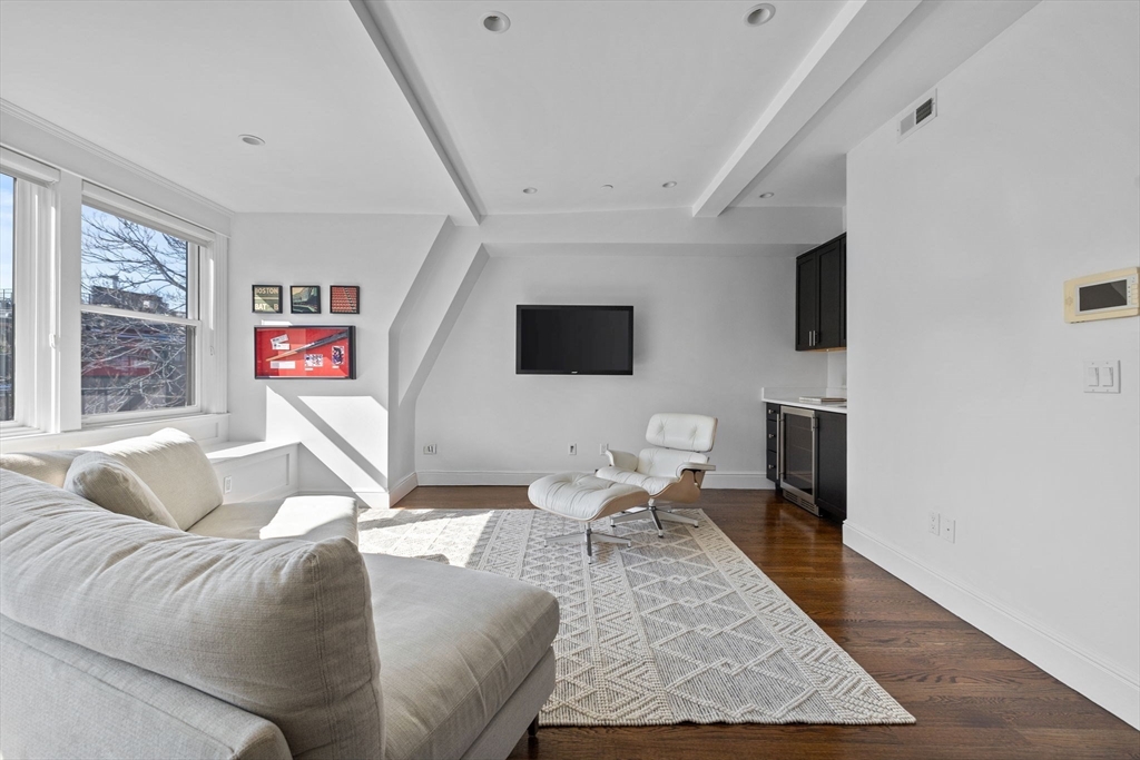 34 Dwight Street, Unit 2 Boston, MA 02118 - Photo 18 of 22 a living room with furniture and a flat screen tv