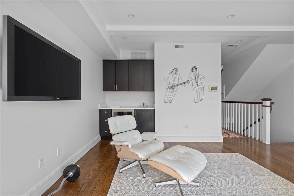 34 Dwight Street, Unit 2 Boston, MA 02118 - Photo 20 of 22 a living room with furniture and a flat screen tv