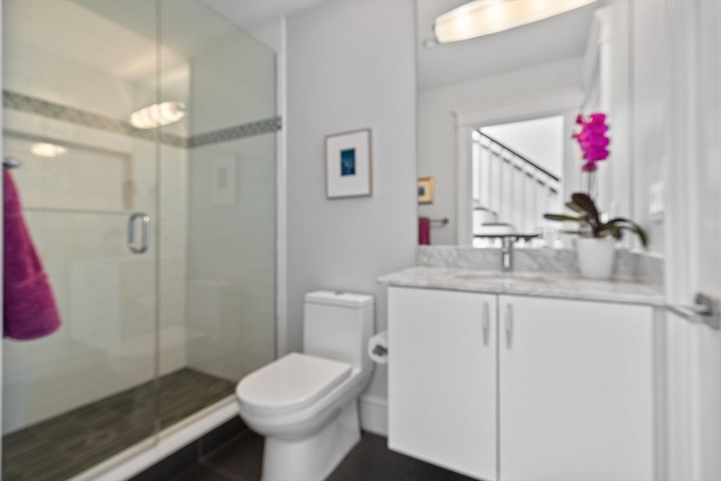 34 Dwight Street, Unit 2 Boston, MA 02118 - Photo 22 of 22 a bathroom with a sink toilet and vanity