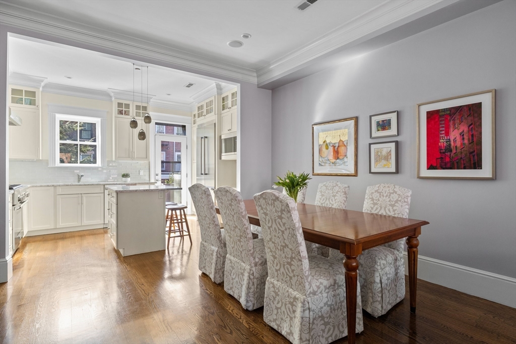 34 Dwight Street, Unit 2 Boston, MA 02118 - Photo 5 of 22 a view of a dining room with furniture and wooden floor