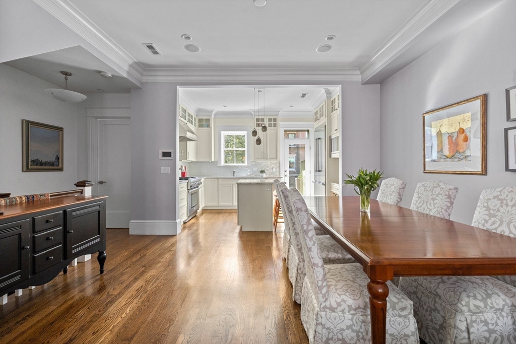 34 Dwight Street, Unit 2 Boston, MA 02118 - Photo 6 of 22 a living room with stainless steel appliances furniture wooden floor and a kitchen view