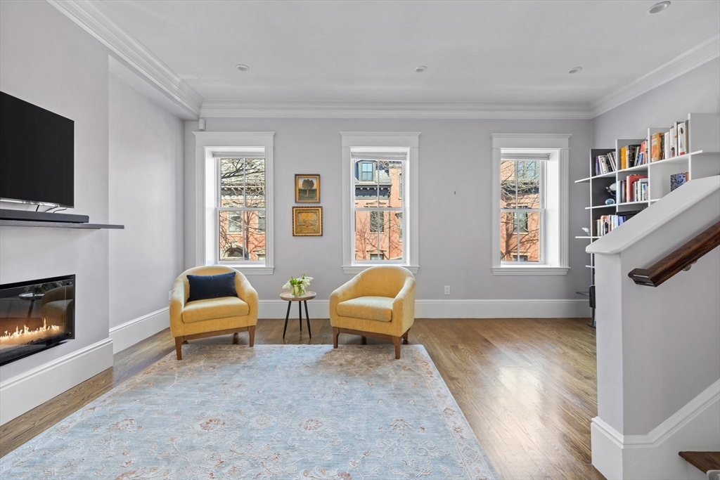 34 Dwight Street, Unit 2 Boston, MA 02118 - Photo 9 of 22 a living room with furniture and a fireplace
