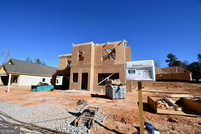 a front view of a building with seating area
