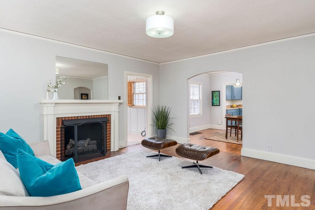 510 Harding Street Raleigh, NC 27604 - Photo 2 of 30 a living room with furniture and a fireplace
