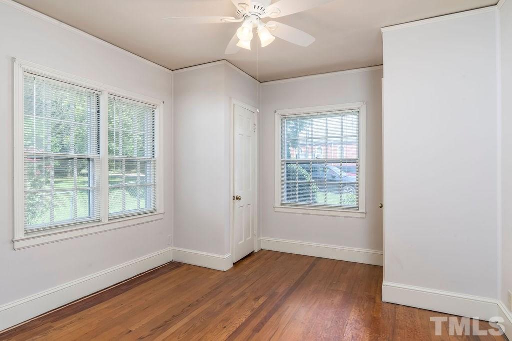 510 Harding Street Raleigh, NC 27604 - Photo 11 of 30 a view of an empty room with wooden floor and a window