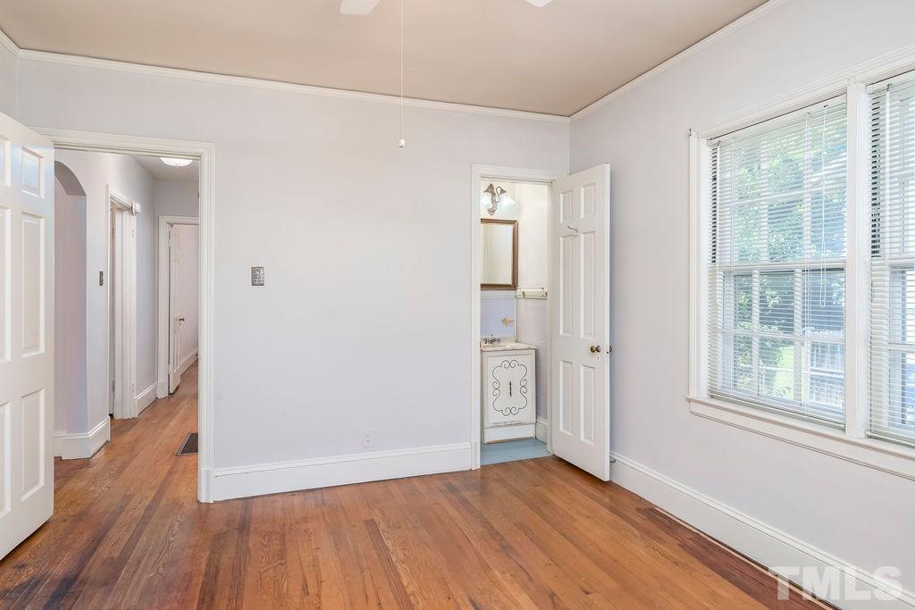 510 Harding Street Raleigh, NC 27604 - Photo 12 of 30 an empty room with wooden floor and windows