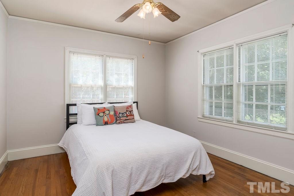 510 Harding Street Raleigh, NC 27604 - Photo 13 of 30 a bedroom with a large bed and a window