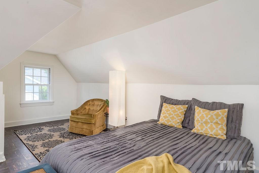 510 Harding Street Raleigh, NC 27604 - Photo 19 of 30 a bedroom with a bed and wooden floor