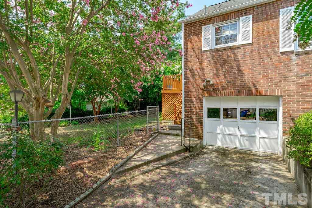 510 Harding Street Raleigh, NC 27604 - Photo 27 of 30 a backyard of a house with lots of green space