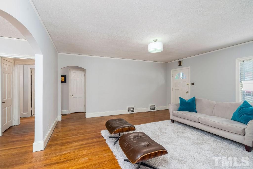 510 Harding Street Raleigh, NC 27604 - Photo 5 of 30 a living room with furniture and wooden floor