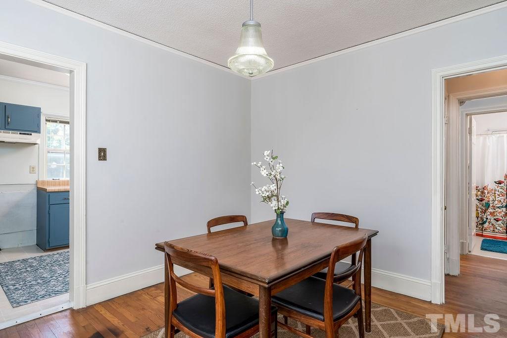 510 Harding Street Raleigh, NC 27604 - Photo 7 of 30 a dining room with furniture and wooden floor