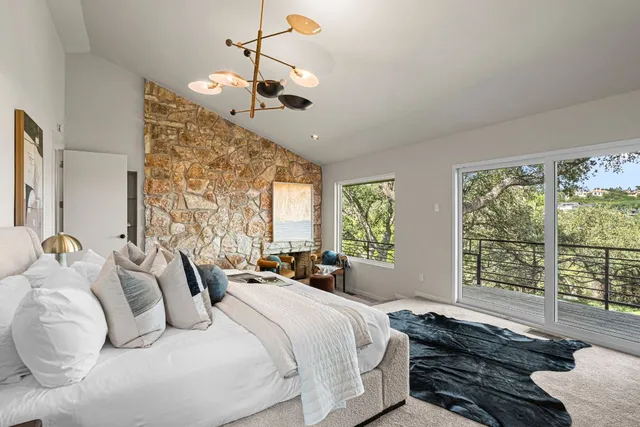 a bedroom with bed and window