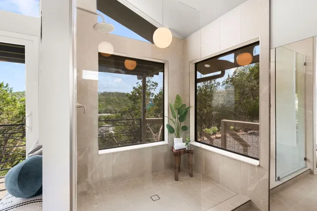 a bathroom with a bathtub and shower