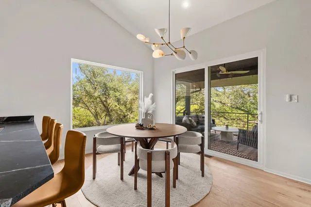 a view of a dining room with furniture window and outside view