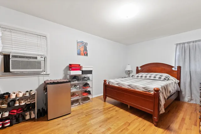 a bedroom with a bed and a tv