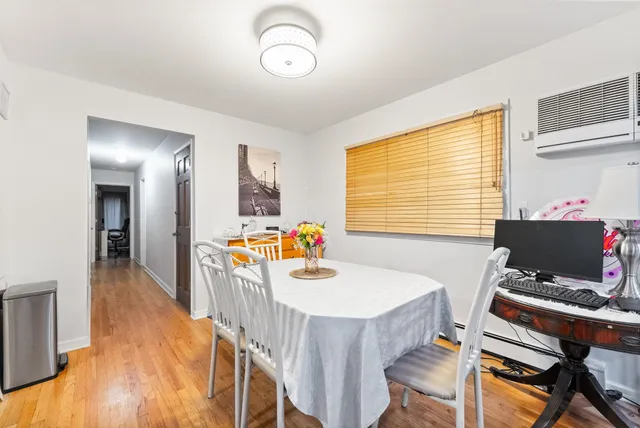 a dining room with furniture and window