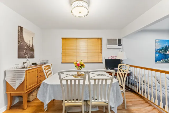 a view of a dining room with furniture and window