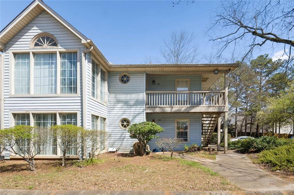 1382 Brockett Place Clarkston, GA 30021 - Photo 1 of 17 a front view of a house with garden