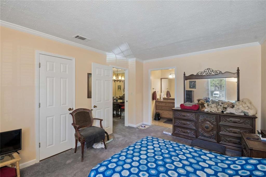 1382 Brockett Place Clarkston, GA 30021 - Photo 15 of 17 a living room with furniture and a flat screen tv