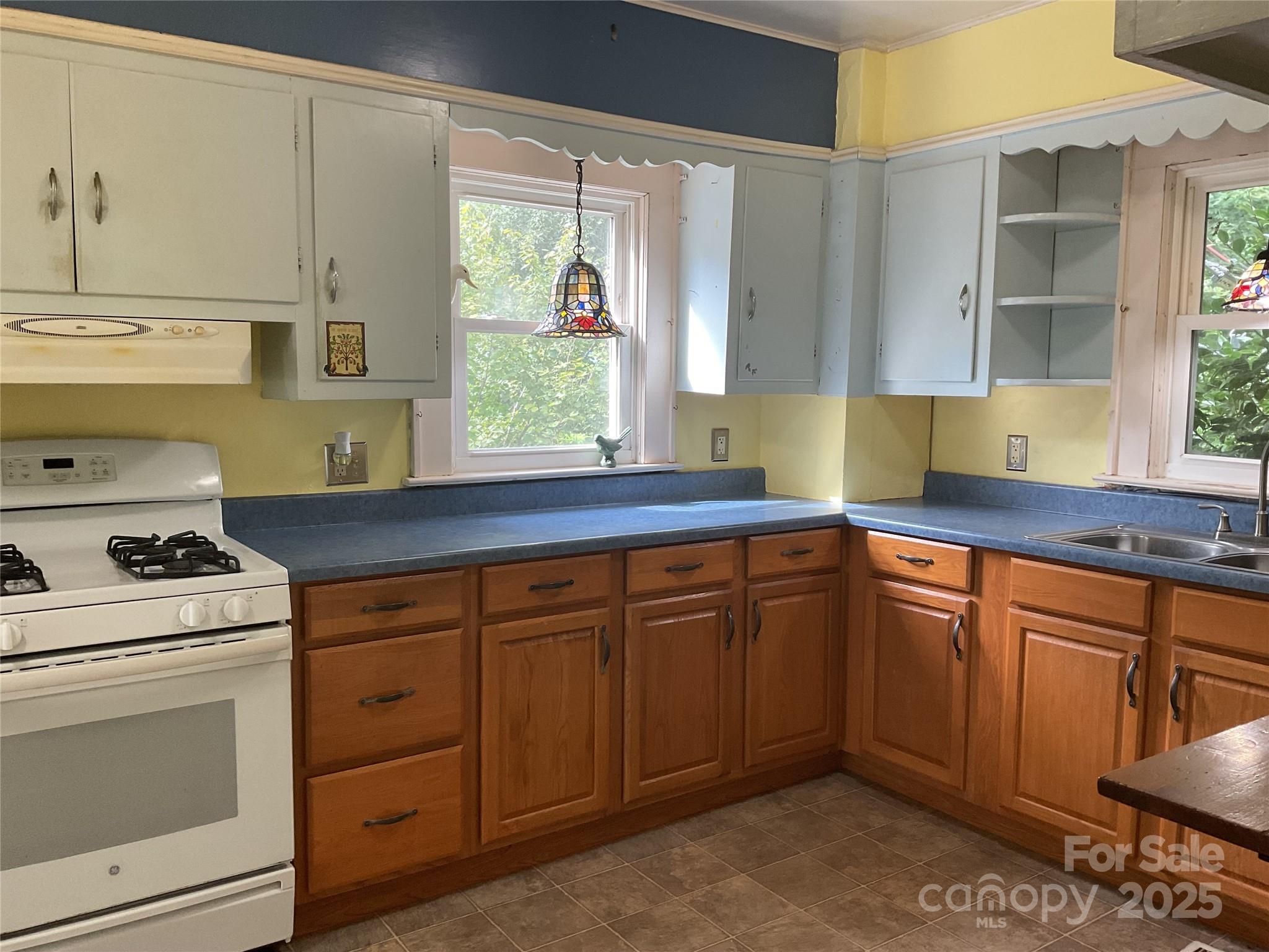 402 Connelly Springs Road Lenoir, NC 28645 - Photo 11 of 33 a kitchen with granite countertop a sink stainless steel appliances and cabinets