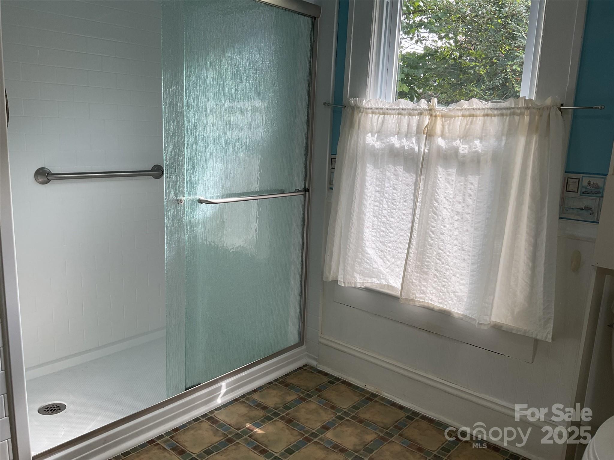 402 Connelly Springs Road Lenoir, NC 28645 - Photo 18 of 33 a view of a small space with wooden floor and a window