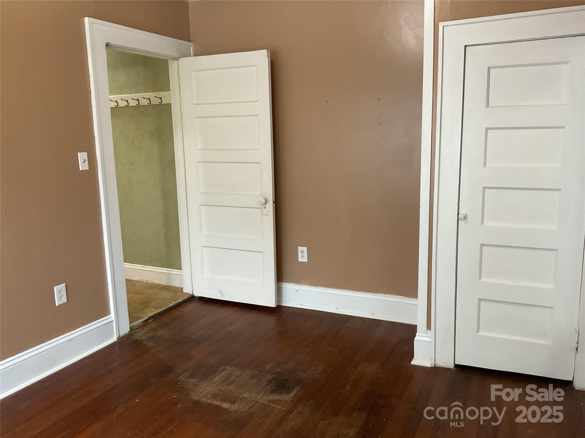 402 Connelly Springs Road Lenoir, NC 28645 - Photo 24 of 33 an empty room with wooden floor and closet
