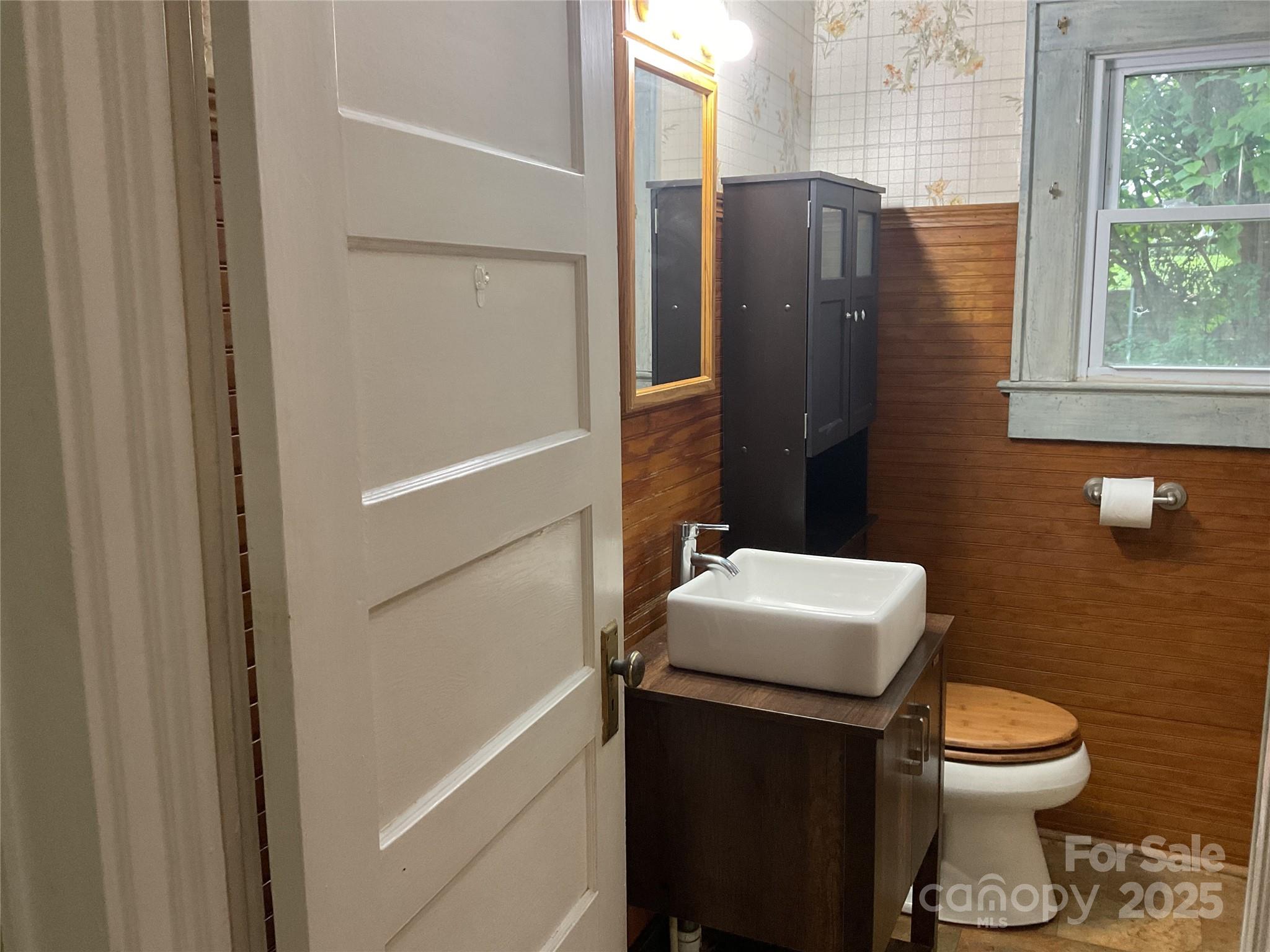 402 Connelly Springs Road Lenoir, NC 28645 - Photo 25 of 33 a bathroom with a sink toilet and window