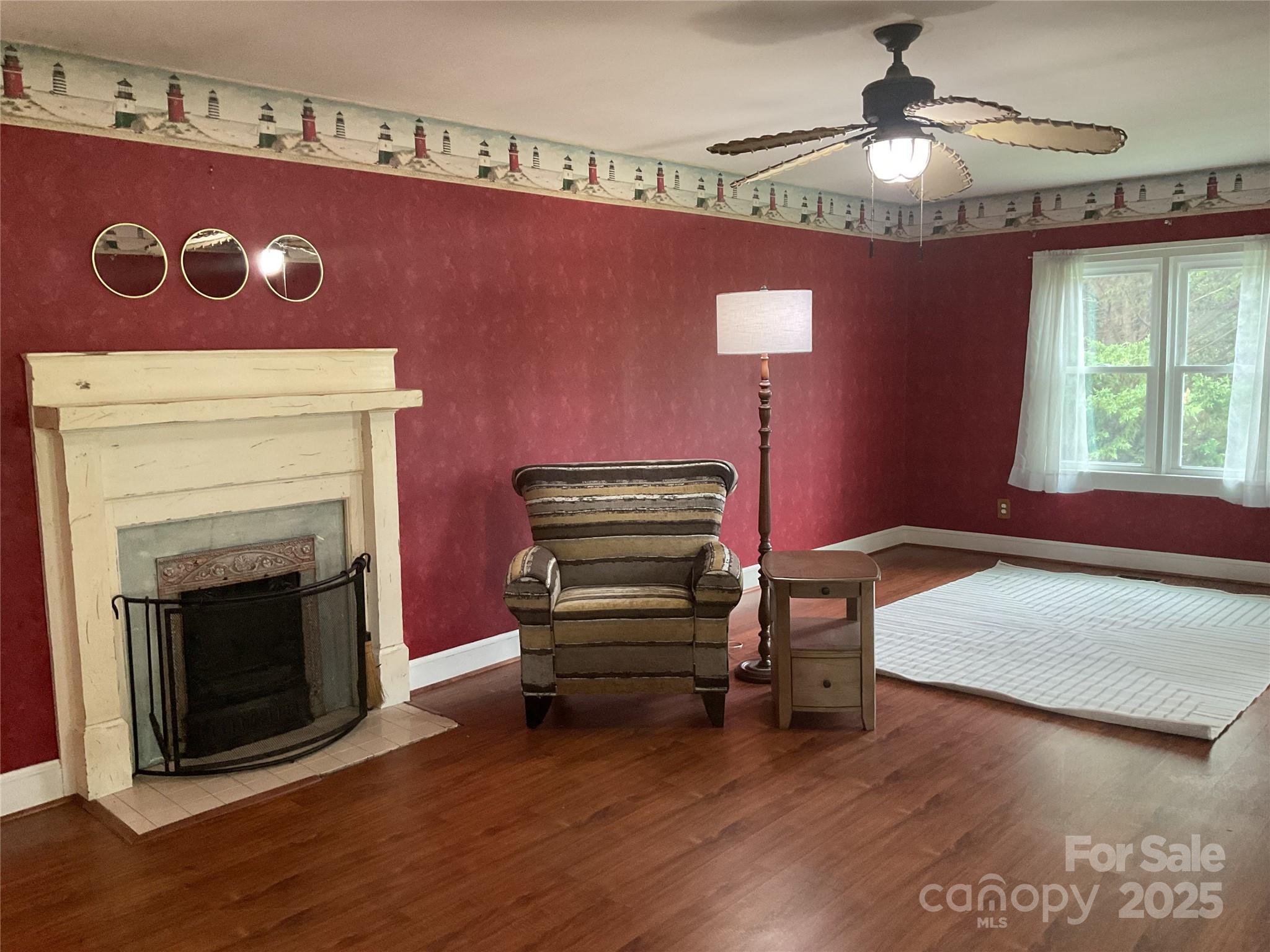 402 Connelly Springs Road Lenoir, NC 28645 - Photo 8 of 33 a bedroom with furniture and a fireplace