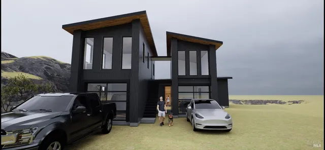 a backyard of a house with wooden fence and trees