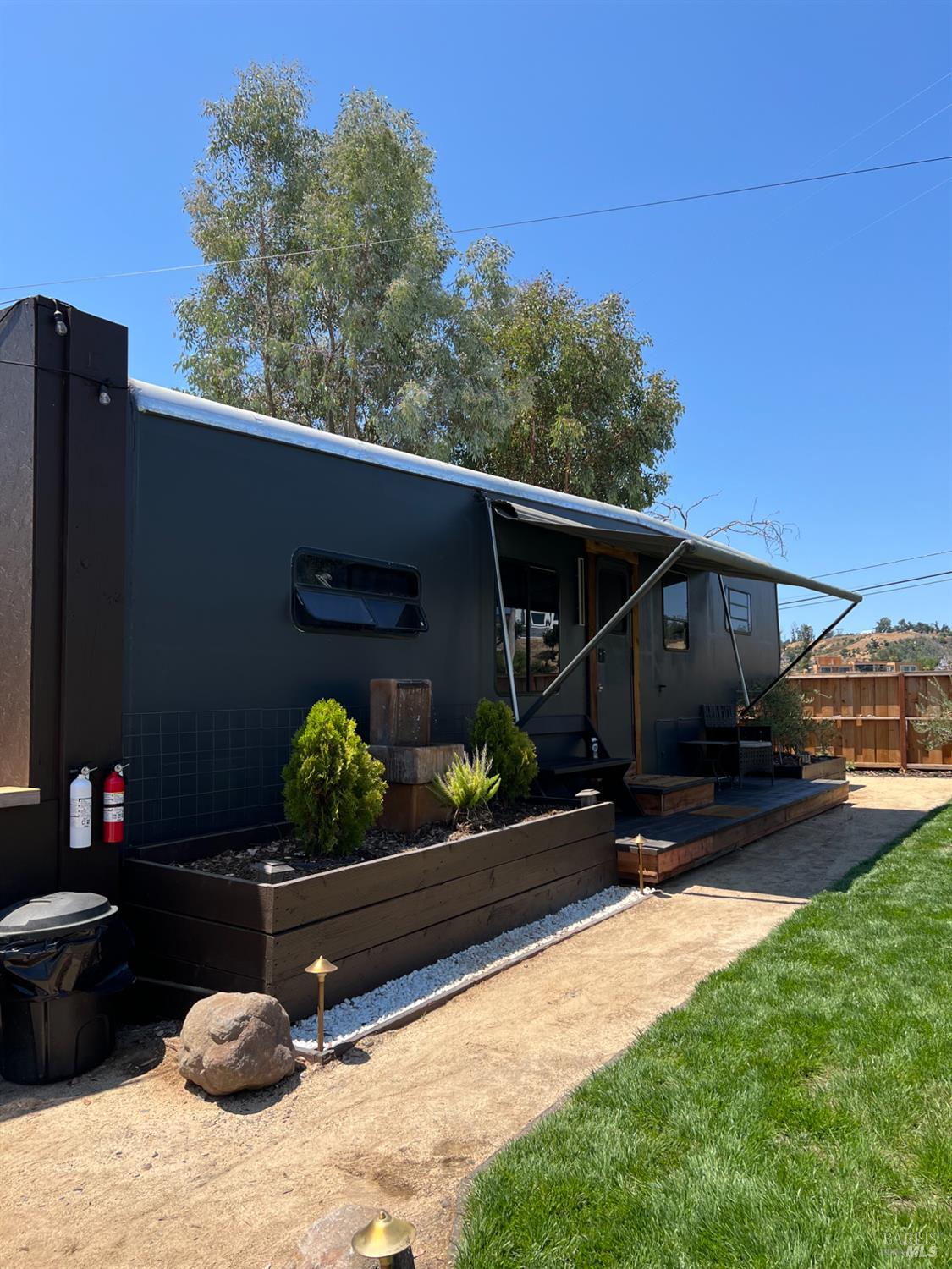 1436 Mark West Springs Road Santa Rosa, CA 95404 - Photo 35 of 39 a backyard of a house with wooden fence and trees