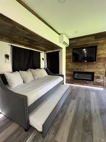 a bedroom with a bed and a mirror