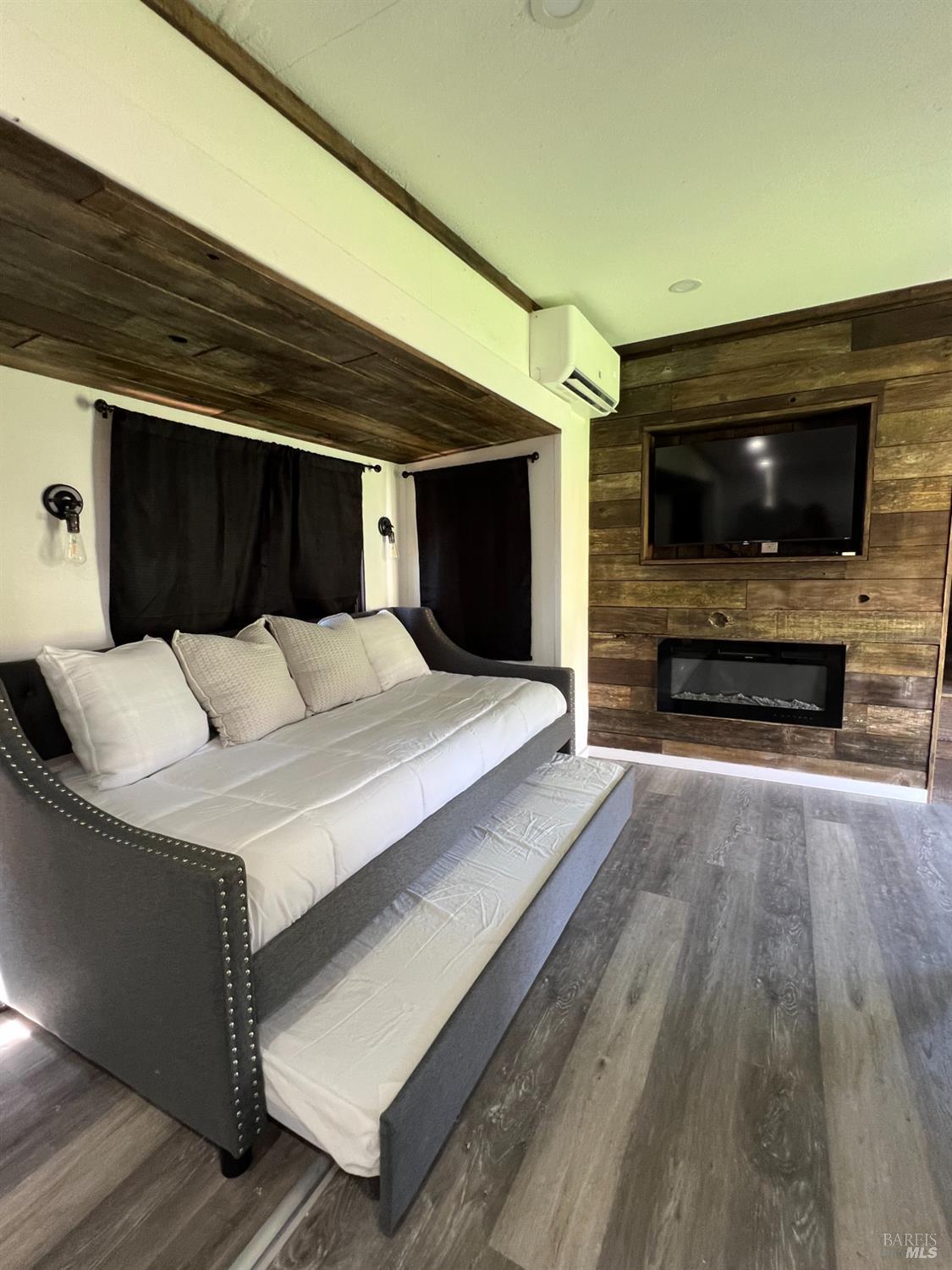 1436 Mark West Springs Road Santa Rosa, CA 95404 - Photo 36 of 39 a living room with furniture and a flat screen tv